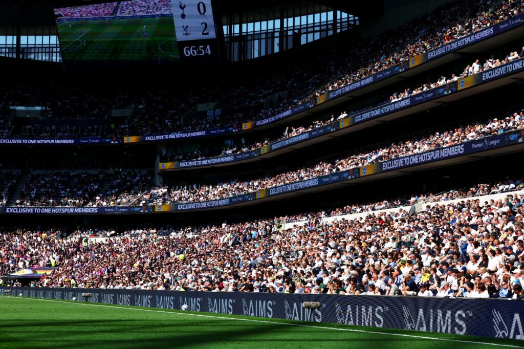 Matchday atmosphere with AIMS branding trackside